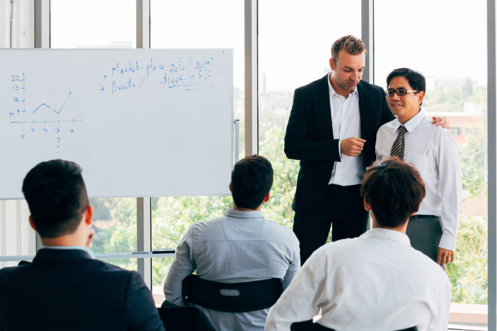 Business professionals enhancing communication and strategic thinking skills during a leadership workshop