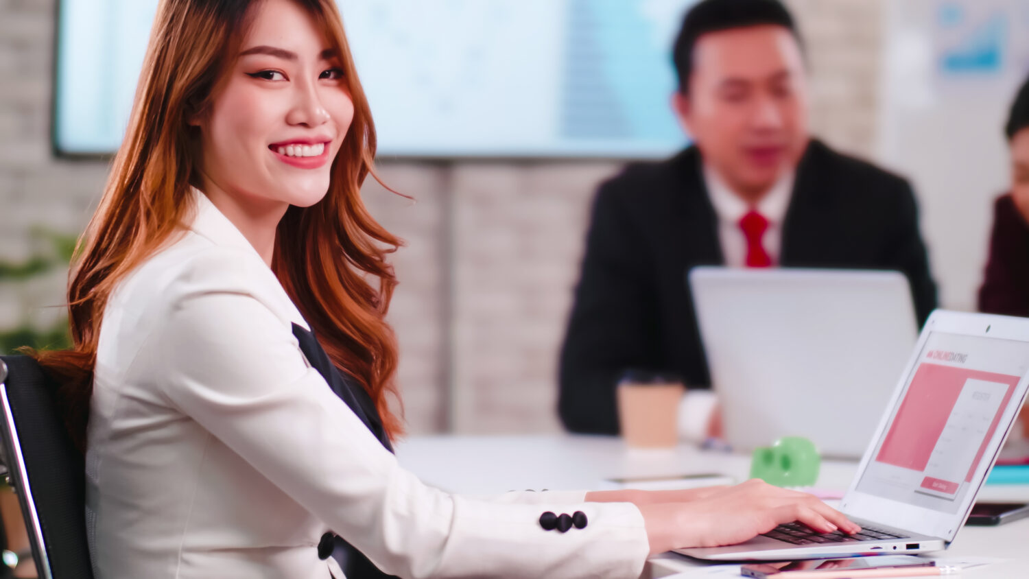 A corporate training workshop in progress, with employees participating in group discussions