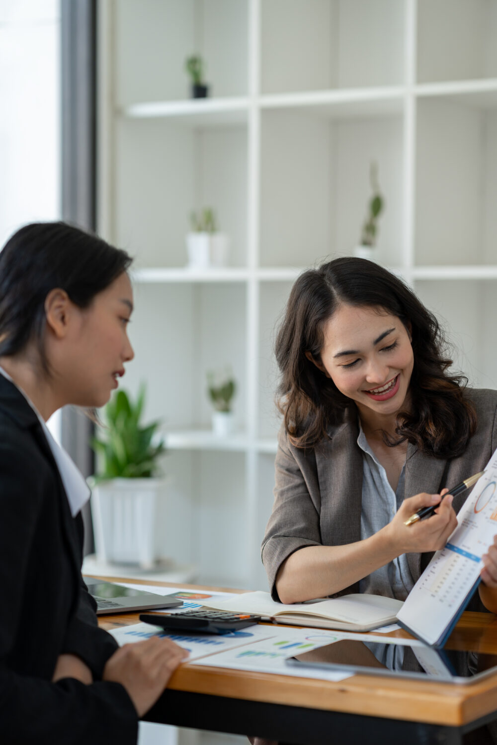 A business consultant in Singapore conducting a leadership development workshop
