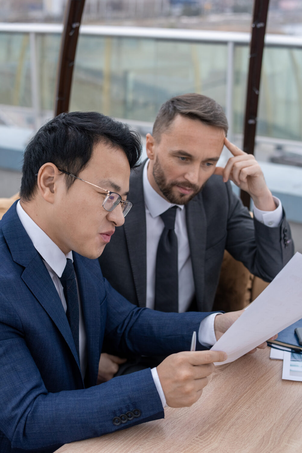 A consultant working closely with a client to solve complex business challenges in Singapore