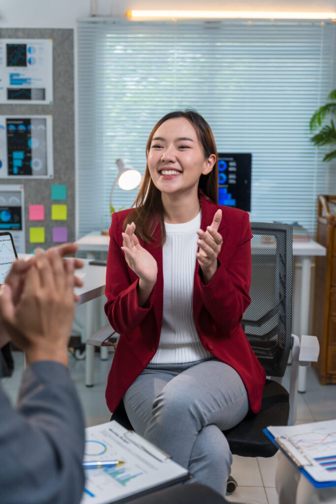 TEI facilitator coaching a participant during a presentation skills practice in Singapore