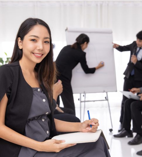 One-on-one coaching session between CEO and executive coach in a modern office
