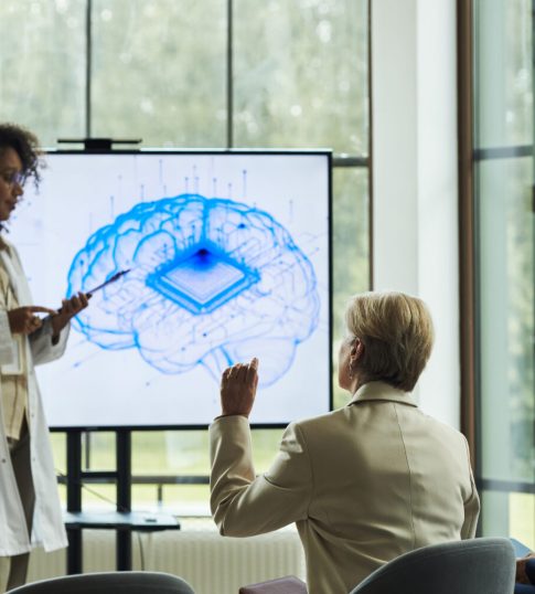 Participants engaging in a Brain Colors Training workshop, collaborating in a group discussion to explore different cognitive styles and how they impact creativity, teamwork, and personal growth